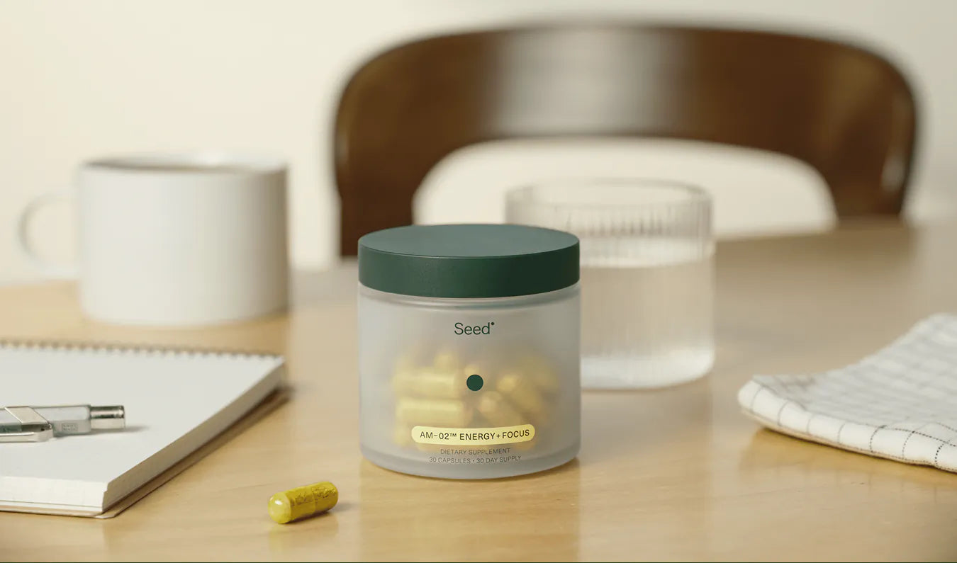 Three capsules with different contents on a yellow background